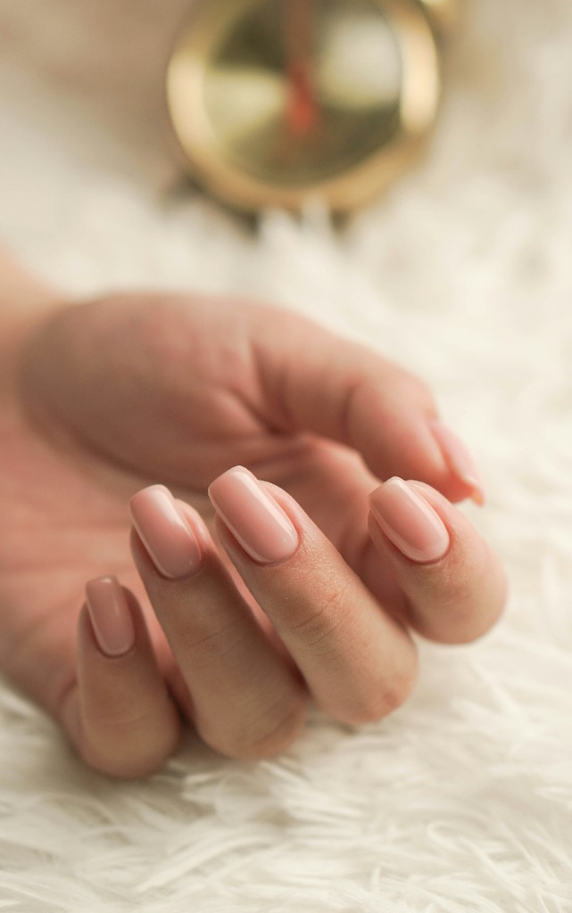 Manicured hands with nude polish